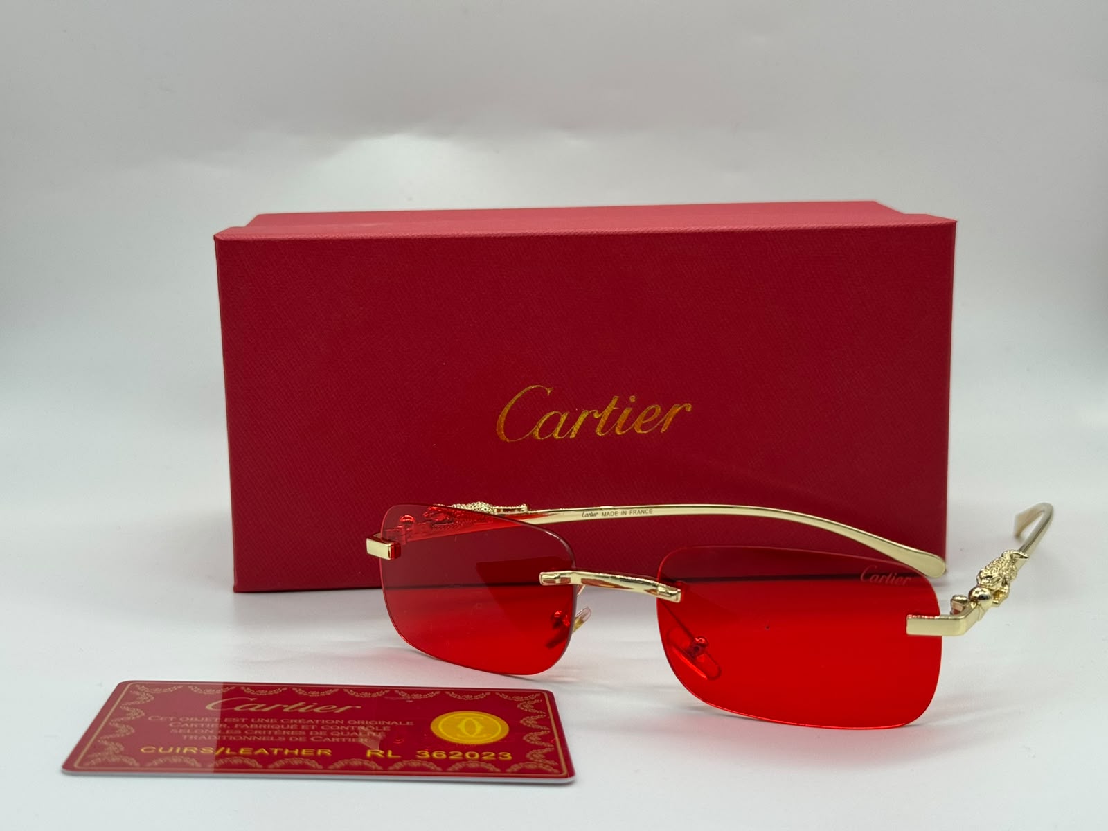 Cartier Panthère de Cartier Rimless Rectangular Sunglasses (Gold / Vibrant Red)