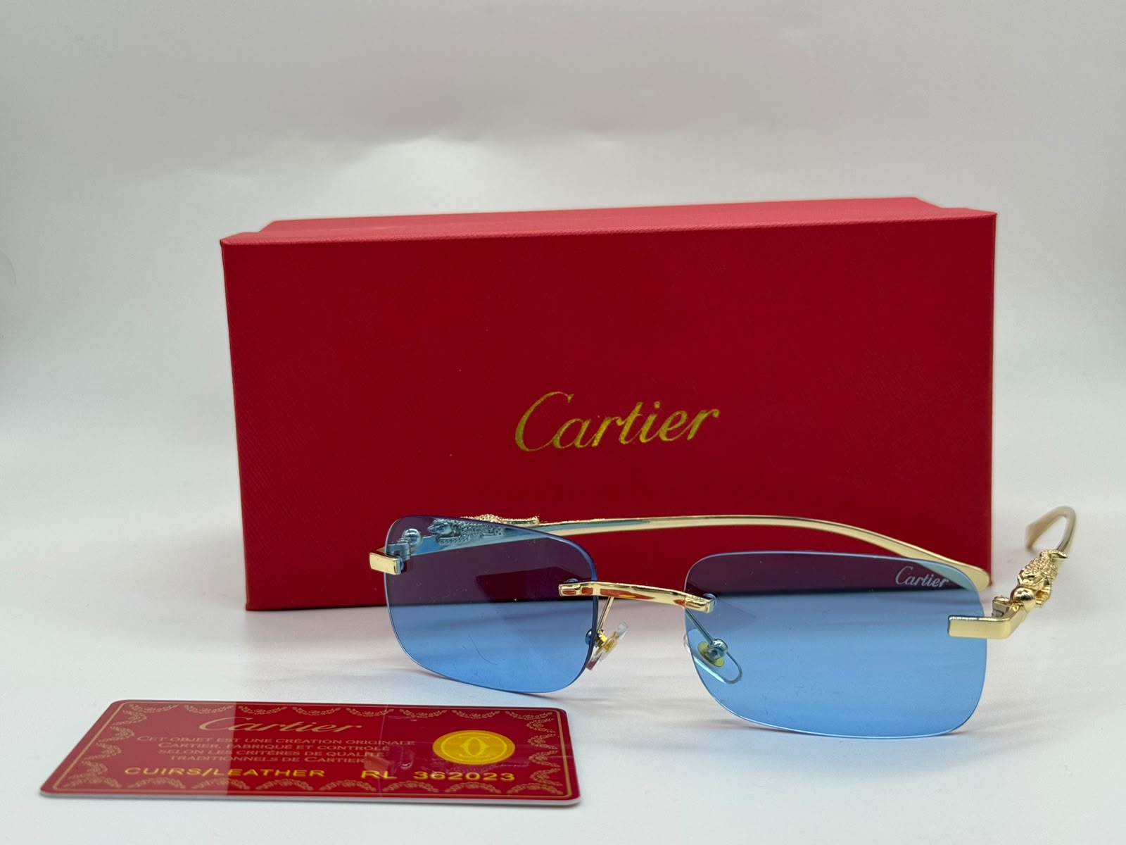 Cartier Panthère de Cartier Rimless Rectangular Sunglasses (Gold / Light Blue)