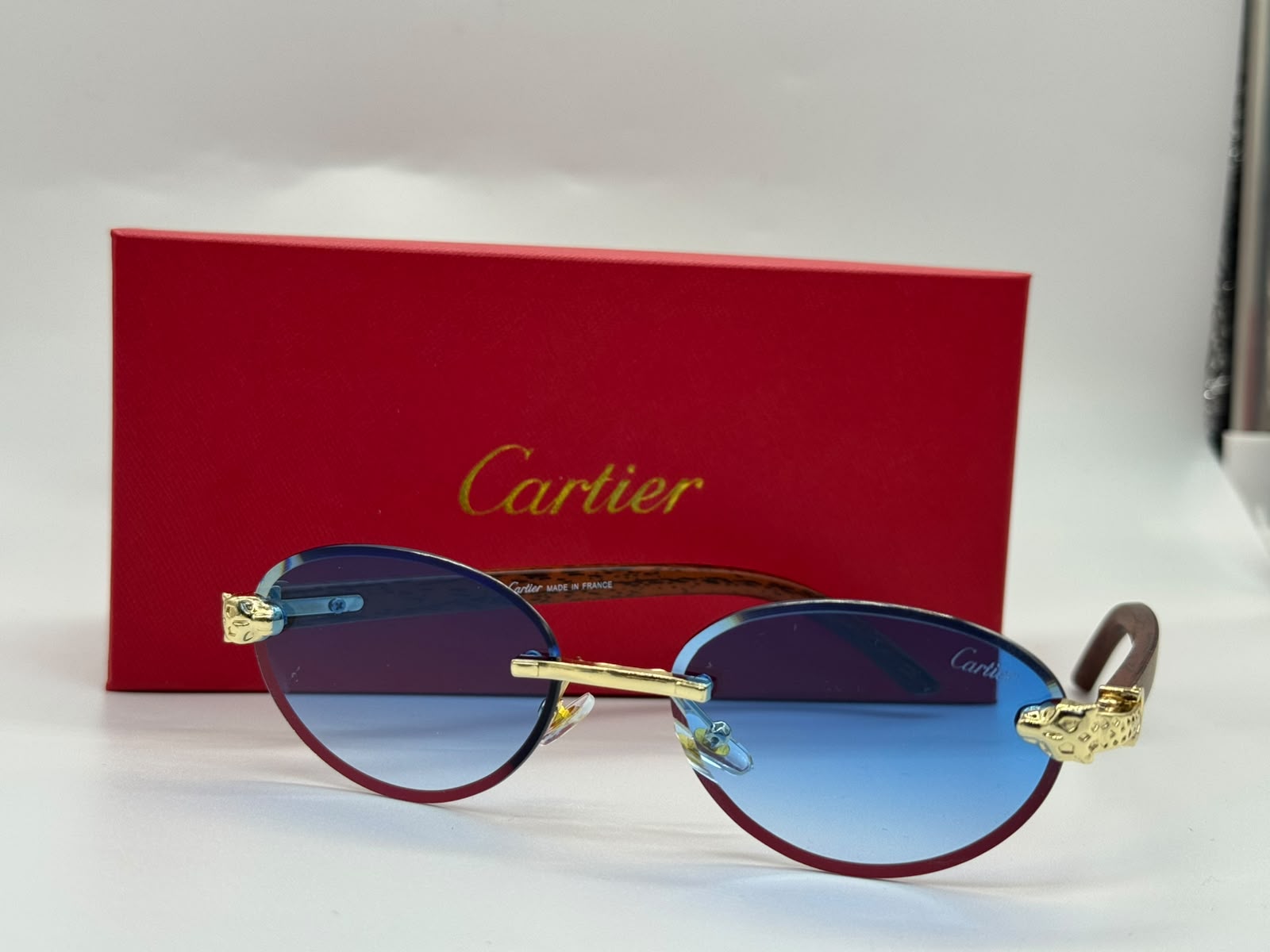 Cartier Panthère de Cartier Rimless Sunglasses (Gold / Blue Gradient)