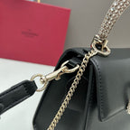 Valentino Garavani Locò Small Leather Top Handle Bag with Crystal VLogo