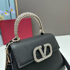 Valentino Garavani Locò Small Leather Top Handle Bag with Crystal VLogo
