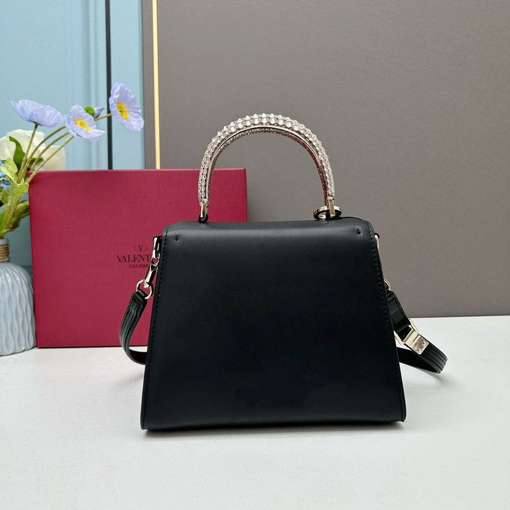Valentino Garavani Locò Small Leather Top Handle Bag with Crystal VLogo