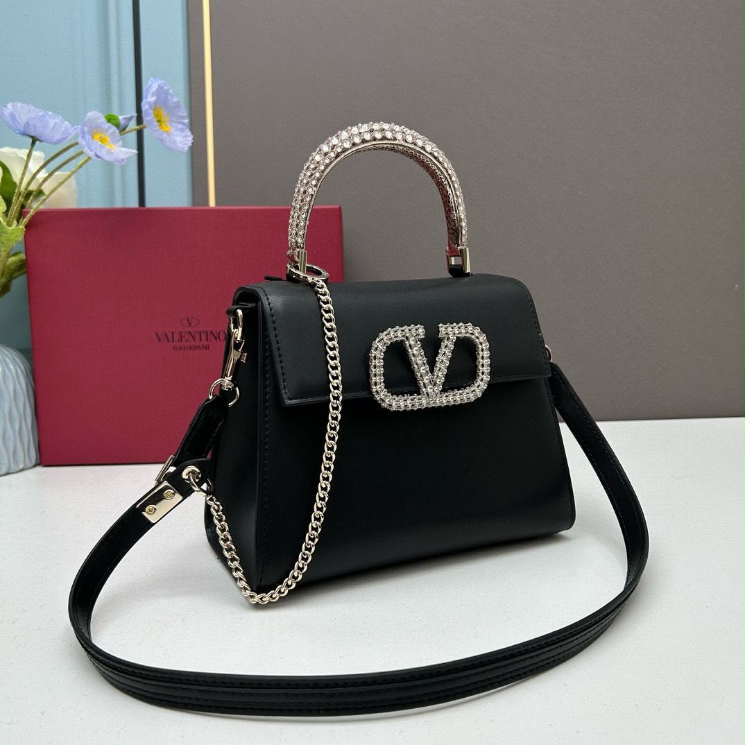 Valentino Garavani Locò Small Leather Top Handle Bag with Crystal VLogo