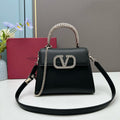 Valentino Garavani Locò Small Leather Top Handle Bag with Crystal VLogo